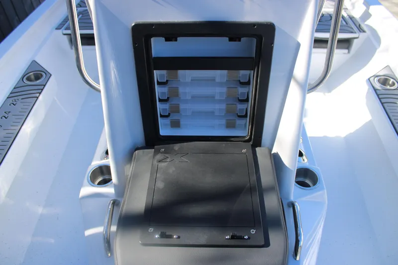 Slide: The Image of 2026 Xpress H20B Bay boat console with storage compartments and cup holders. - 17