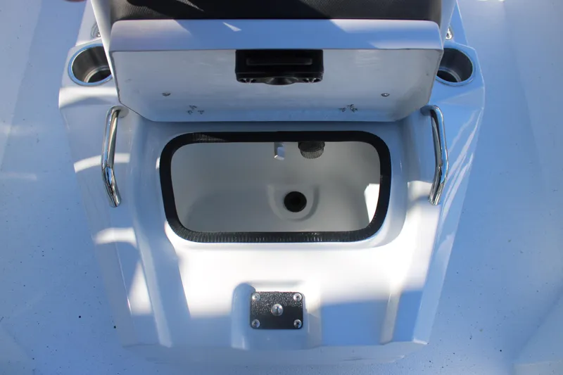 Slide: The Image of 2026 Xpress H20B Bay boat interior with storage compartment and cup holders. - 18