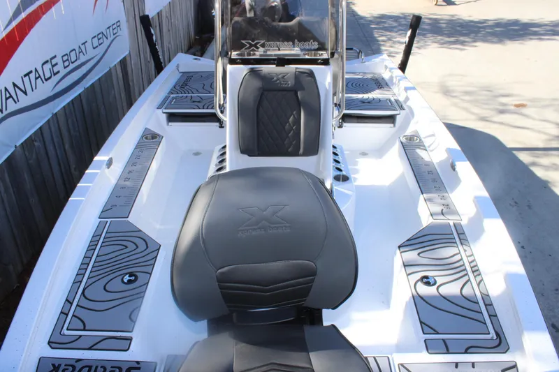 Slide: The Image of 2026 Xpress H20B Bay boat interior with sleek seating and modern design. - 22