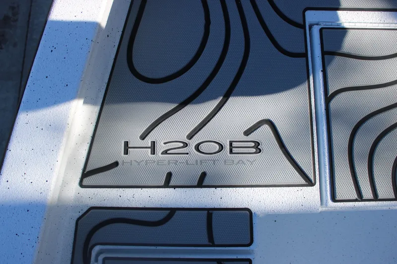 Slide: The Image of 2026 Xpress H20B Bay boat deck with stylish design and branding. - 23