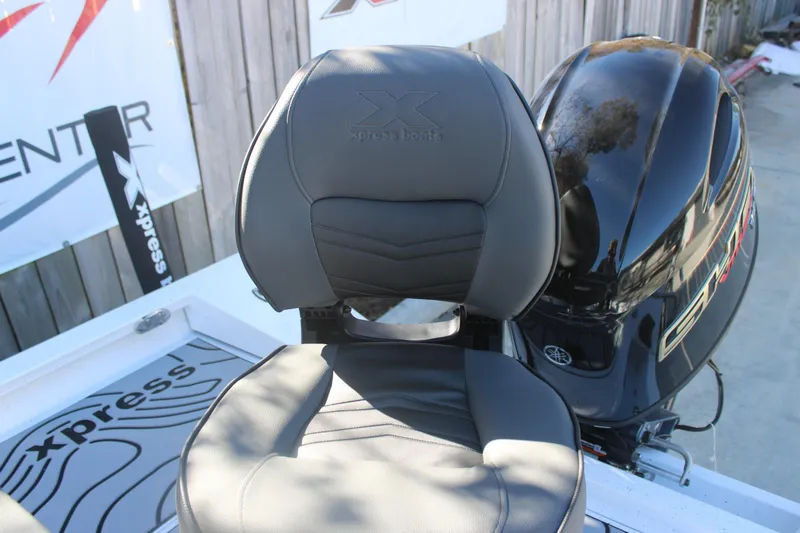 Slide: The Image of 2026 Xpress H20B Bay boat seat and motor detail. - 7