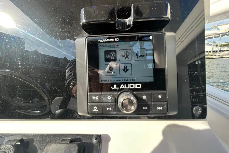 Slide: The Image of JL Audio MediaMaster 50 on 2025 Sea Hunt Ultra 229 boat dashboard. - 20