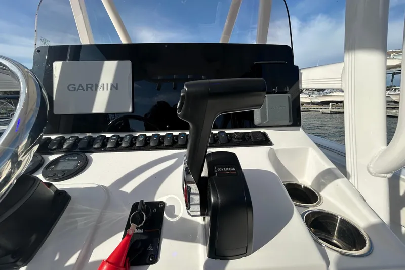 Slide: The Image of Control panel of 2025 Sea Hunt Ultra 229 boat with Garmin and Yamaha equipment. - 23
