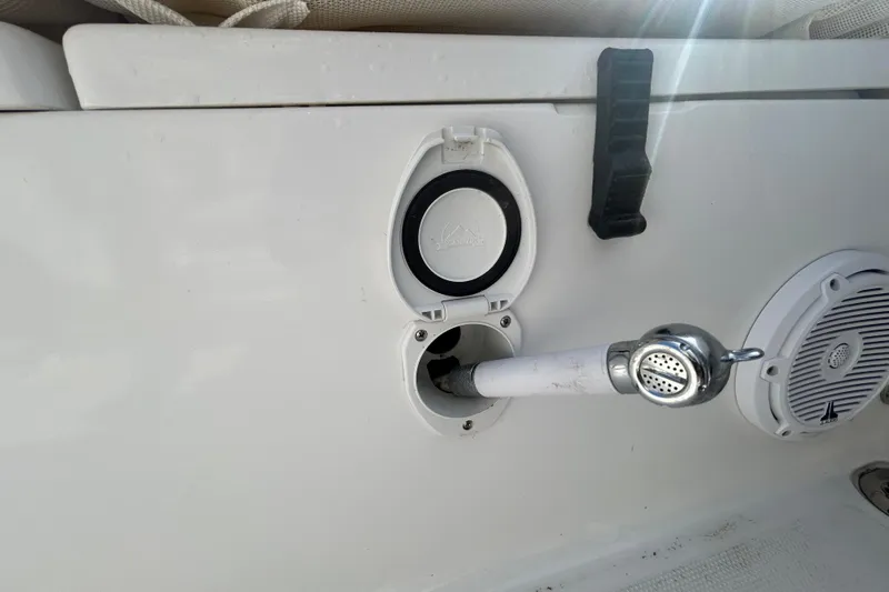 Slide: The Image of Sea Hunt Ultra 229 boat shower and speaker detail, 2025 model. - 25