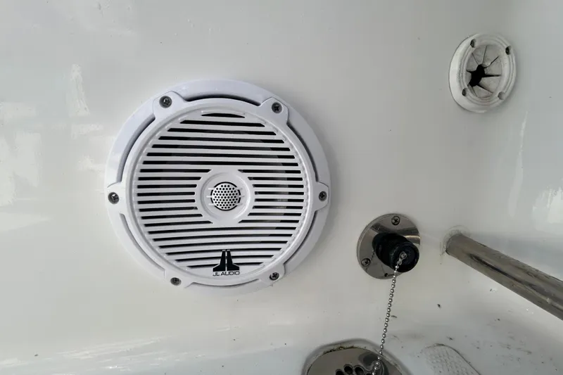 Slide: The Image of White JL Audio speaker on 2025 Sea Hunt Ultra 229 boat interior. - 26