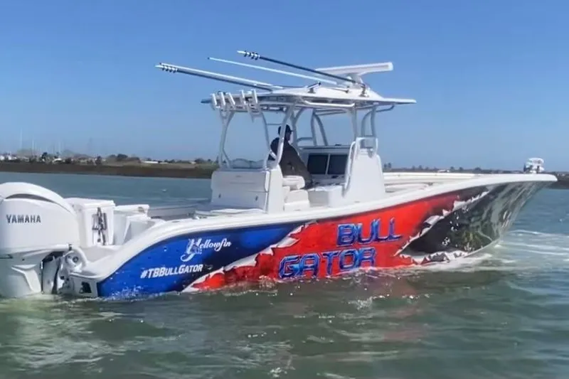 The Image of 2024 Yellowfin 36 Offshore boat with vibrant "Bull Gator" graphics on the water. - 0