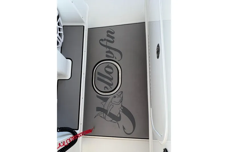 Slide: The Image of 2024 Yellowfin 36 Offshore boat deck with logo and fish graphic. - 18