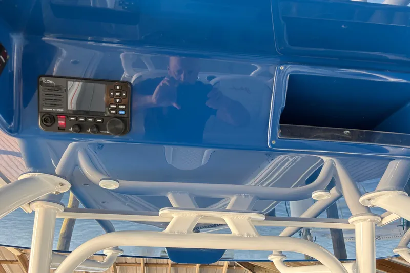 Slide: The Image of 2024 Yellowfin 36 Offshore boat console with radio and storage compartment. - 20