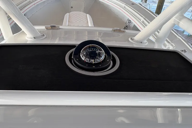 Slide: The Image of 2024 Yellowfin 36 Offshore boat compass and dashboard view. - 22