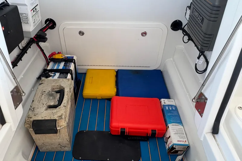 Slide: The Image of Storage compartment of 2024 Yellowfin 36 Offshore boat with equipment and supplies. - 25
