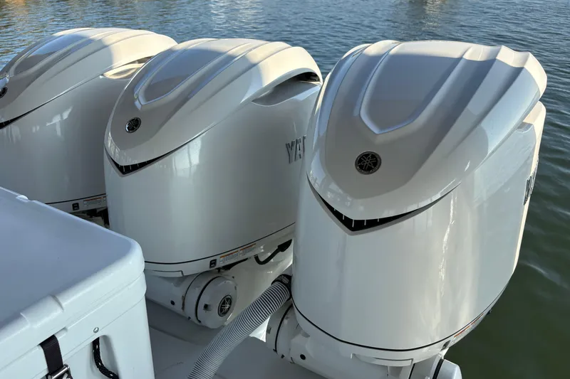 Slide: The Image of Triple outboard engines on a 2024 Yellowfin 36 Offshore boat. - 6