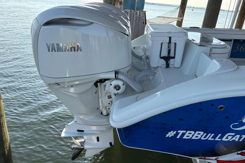 Slide: The Image of 2024 Yellowfin 36 Offshore boat with Yamaha outboard motor, docked by the water. - 7