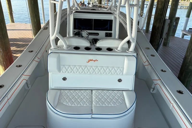 Slide: The Image of 2024 Yellowfin 36 Offshore boat interior with white seating and diamond stitching. - 8