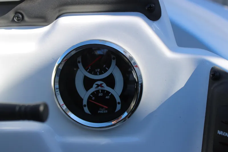 Slide: The Image of Close-up of Xpress H20 2026 boat gauge on white dashboard. - 12
