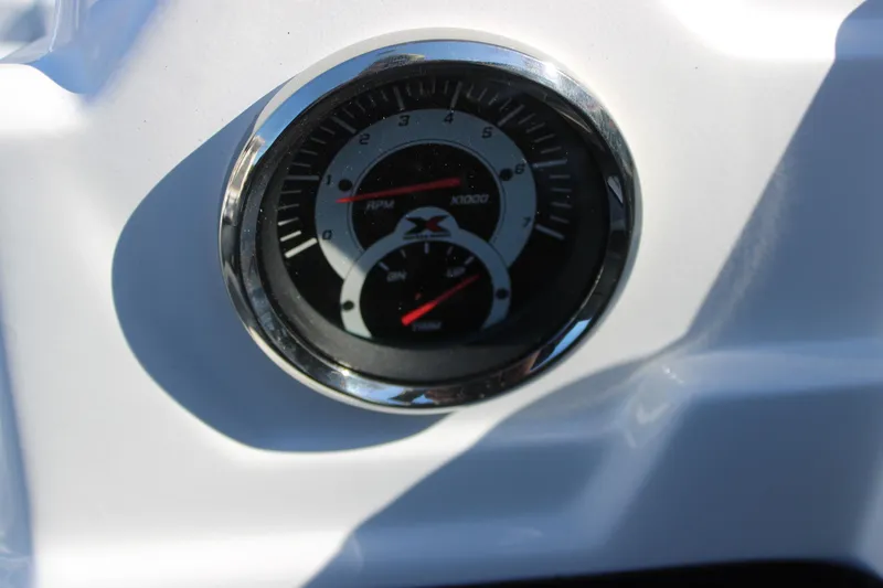 Slide: The Image of Close-up of Xpress H20 2026 RPM gauge on a white dashboard. - 13