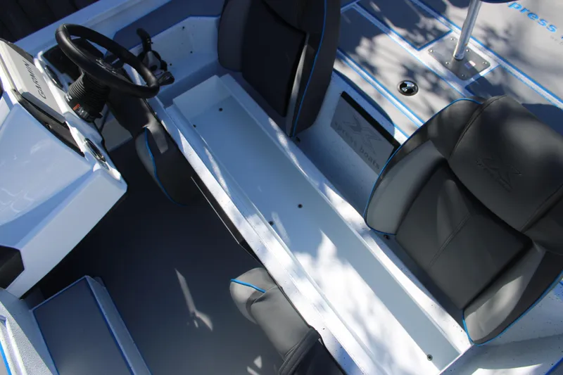 Slide: The Image of 2026 Xpress H20 boat interior with steering wheel and seating. - 14