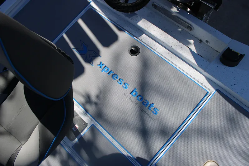Slide: The Image of Interior of 2026 Xpress H20 boat with branded flooring and seating. - 15