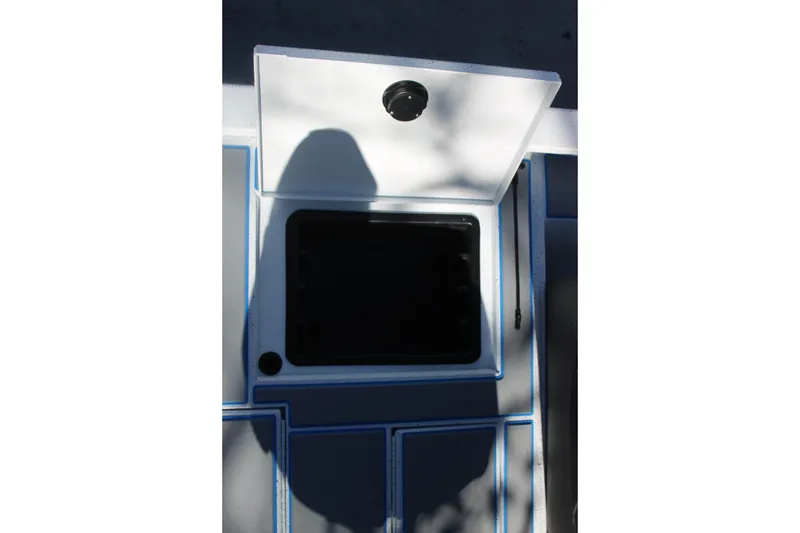 Slide: The Image of Open storage compartment on 2026 Xpress H20 boat deck. - 17