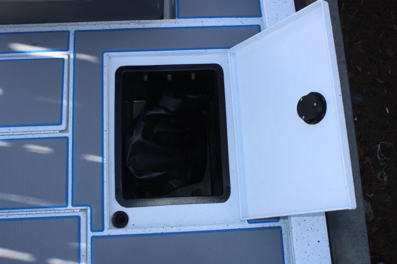 Slide: The Image of Open storage compartment on 2026 Xpress H20 boat deck. - 19
