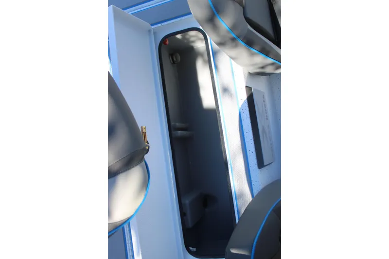 Slide: The Image of Interior view of 2026 Xpress H20 boat storage compartment. - 20