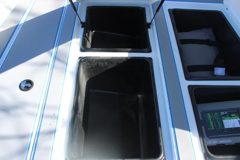 Slide: The Image of Open storage compartments on 2026 Xpress H20 boat deck. - 24