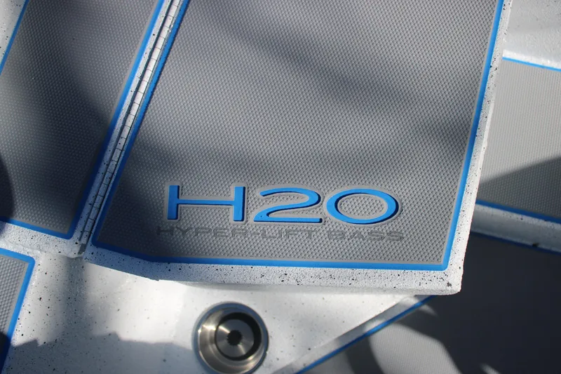 Slide: The Image of Xpress H20 2026 boat deck with blue accents and Hyper-Lift Bass logo. - 26