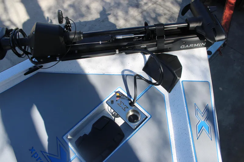 Slide: The Image of Xpress H20 2026 boat deck with Garmin equipment and control panel. - 27