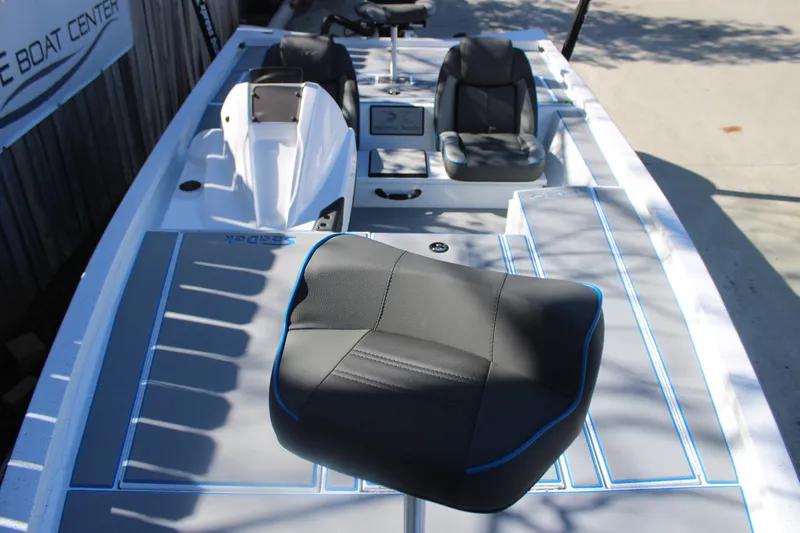 Slide: The Image of 2026 Xpress H20 boat interior with seating and console, featuring sleek design and modern materials. - 29