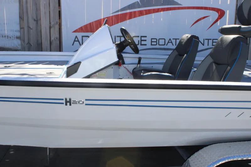 Slide: The Image of 2026 Xpress H20 boat with sleek design and comfortable seating. - 31