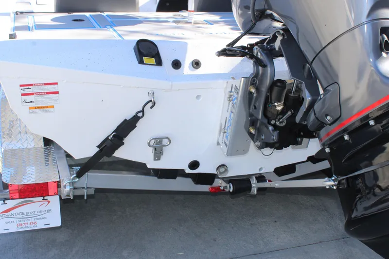Slide: The Image of Rear view of 2026 Xpress H20 boat with motor and trailer attachment. - 6