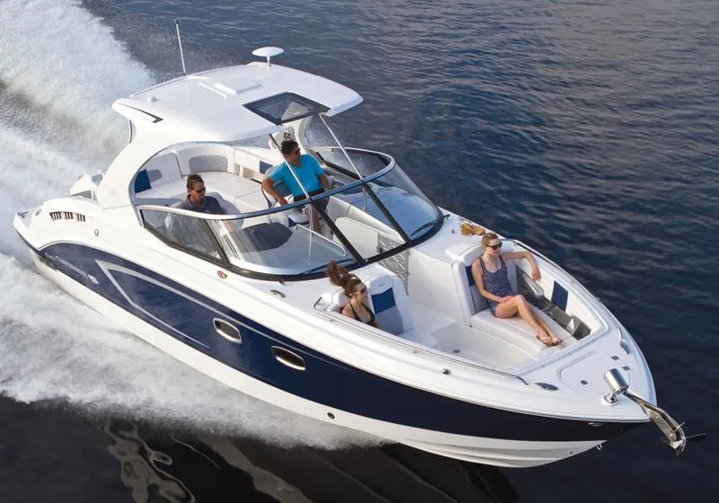 The Image of Manufacturer Provided Image: 2013 Chaparral 327 SSX boat cruising with passengers on a lake. - 0