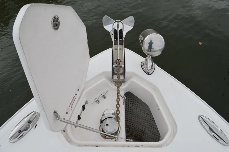 Slide: The Image of 2013 Chaparral 327 SSX boat anchor compartment with open hatch and chain. - 12