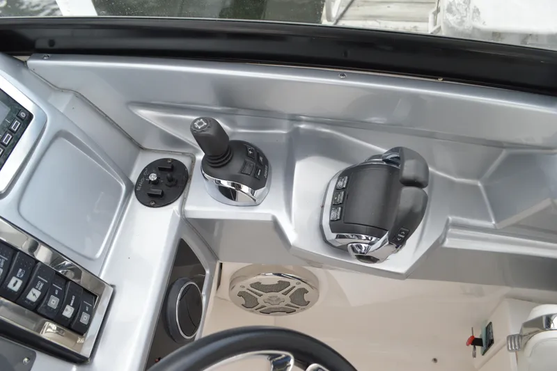 Slide: The Image of Control panel of 2013 Chaparral 327 SSX boat with joystick and throttle. - 21