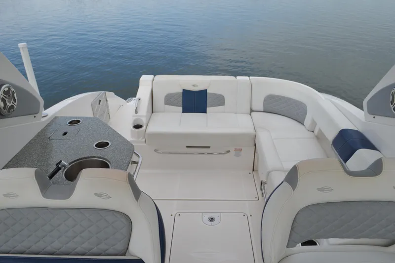 Slide: The Image of 2013 Chaparral 327 SSX boat interior with luxurious seating and sleek design. - 27