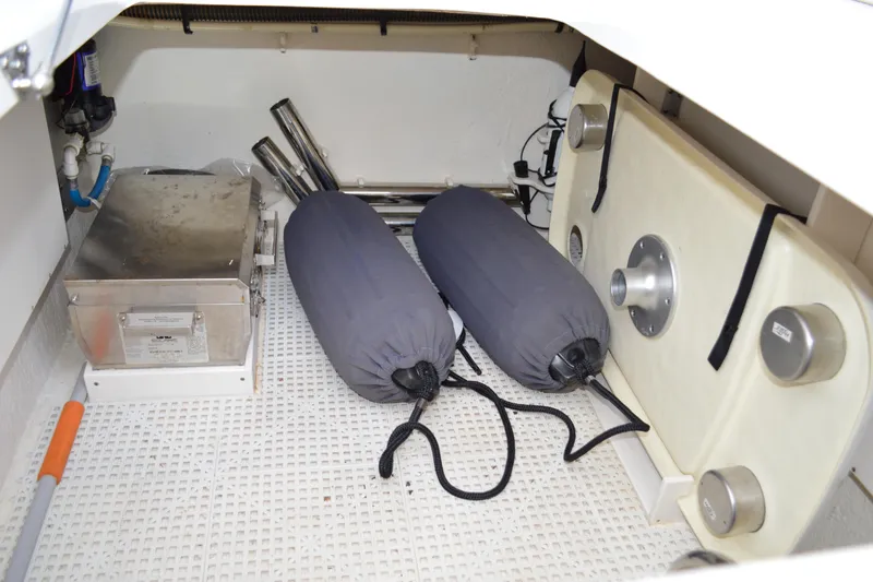 Slide: The Image of 2013 Chaparral 327 SSX storage compartment with equipment and accessories. - 32