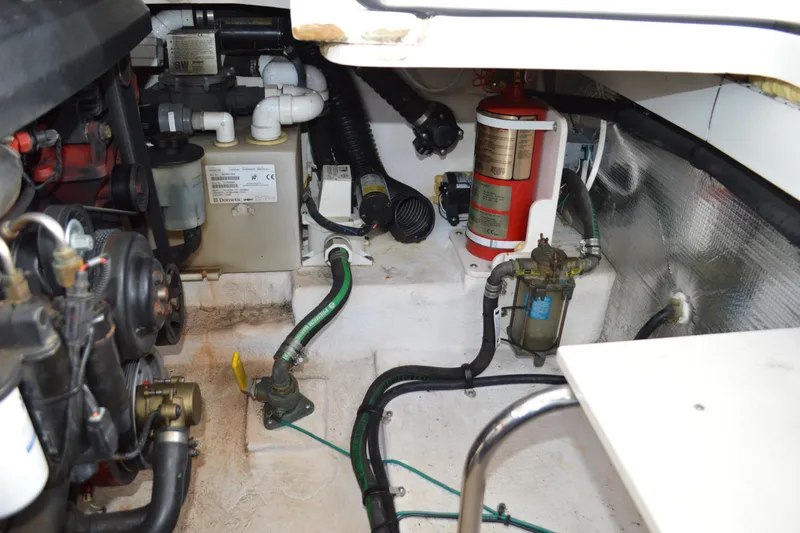 Slide: The Image of Engine compartment of 2013 Chaparral 327 SSX boat with visible components and wiring. - 52