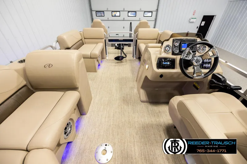 Slide: The Image of Luxurious 2020 Avalon VEN FNC pontoon boat interior with beige seating and modern dashboard. - 17