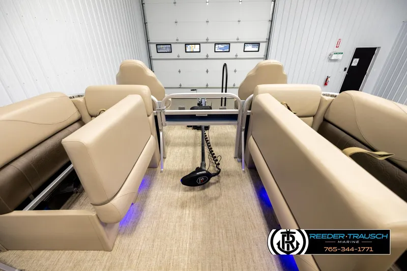 Slide: The Image of Interior of 2020 Avalon VEN FNC boat with beige seating and blue accent lighting. - 19