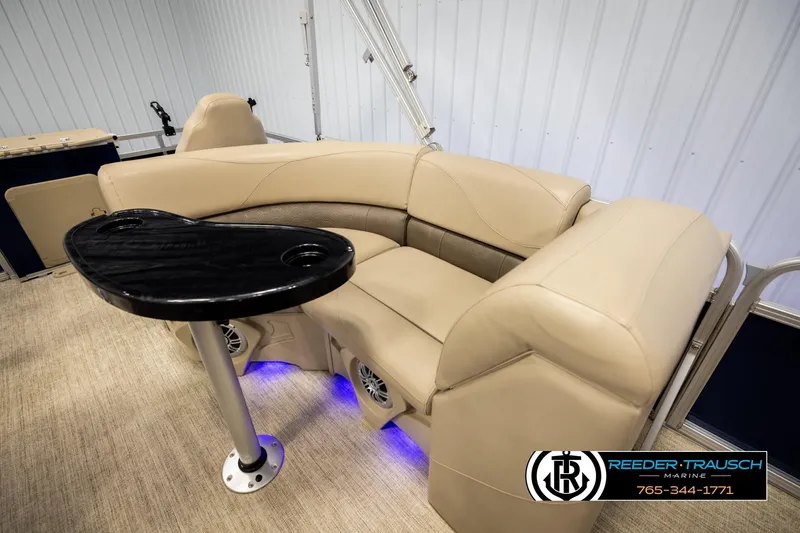 Slide: The Image of Luxurious Avalon VEN FNC 2020 boat interior with beige seating and black table. - 21