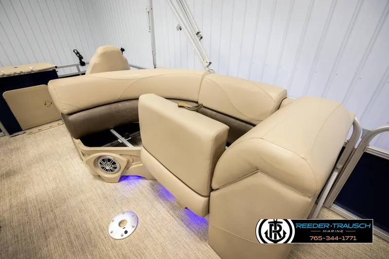 Slide: The Image of Luxurious seating on 2020 Avalon VEN FNC boat with beige upholstery and blue LED lighting. - 22