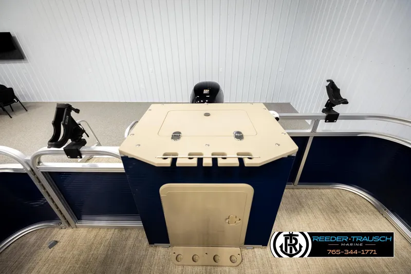 Slide: The Image of 2020 Avalon VEN FNC boat interior with storage compartment and rod holders. - 23