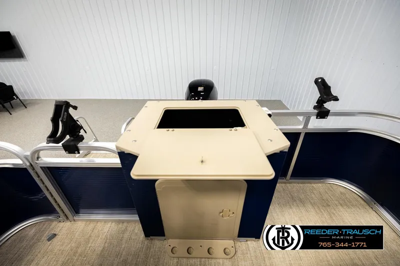 Slide: The Image of 2020 Avalon VEN FNC boat interior with fishing rod holders and control panel. - 24