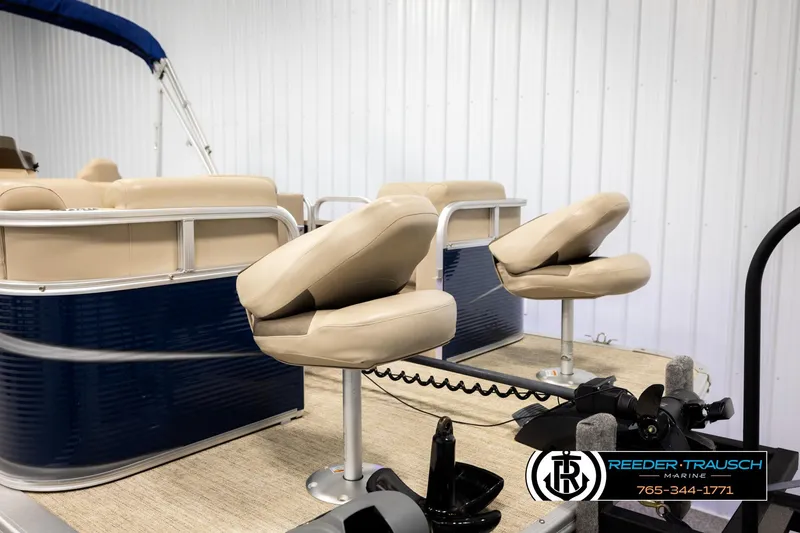 Slide: The Image of 2020 Avalon VEN FNC pontoon boat with beige seating and blue exterior. - 27