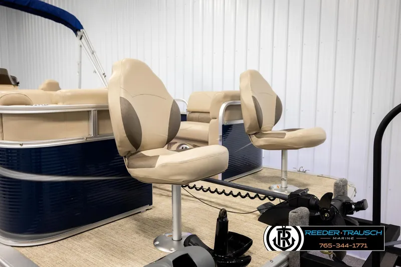 Slide: The Image of 2020 Avalon VEN FNC pontoon boat with beige seating and blue exterior. - 28