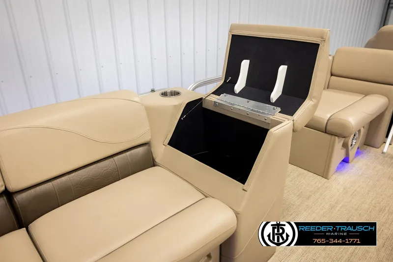 Slide: The Image of 2020 Avalon VEN FNC boat interior with beige seating and storage compartment. - 30