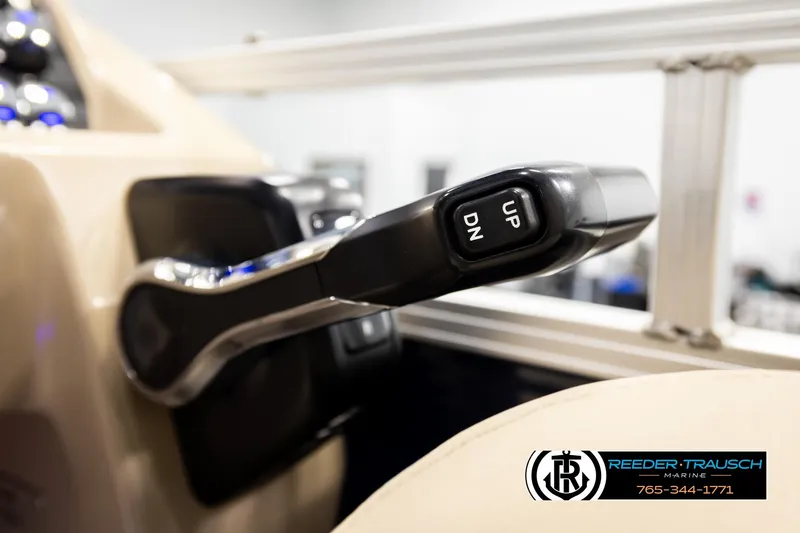 Slide: The Image of Close-up of Avalon VEN FNC 2020 boat throttle lever with "UP" and "DN" buttons. - 38