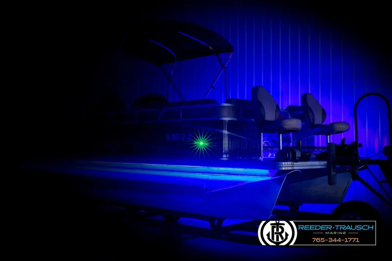 Slide: The Image of 2020 Avalon VEN FNC boat with blue LED lighting in a dark setting. - 4