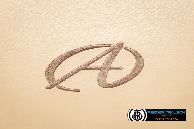 Slide: The Image of Embroidered Avalon logo on beige leather, 2020 VEN FNC model, Reeder-Trausch Marine branding. - 41