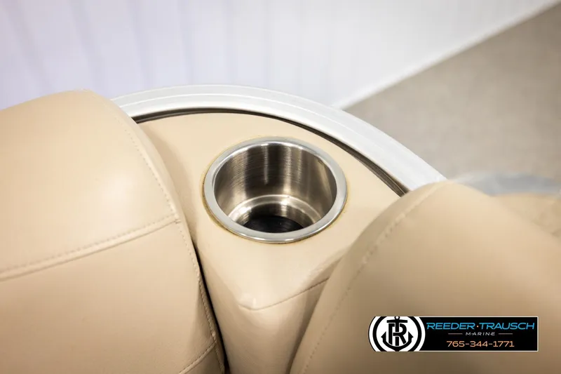 Slide: The Image of Avalon VEN FNC 2020 boat interior with beige seating and stainless steel cup holder. - 44