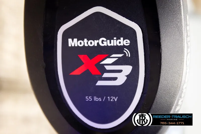 Slide: The Image of Close-up of MotorGuide X3 label, 55 lbs/12V, Reeder-Trausch Marine branding. - 48